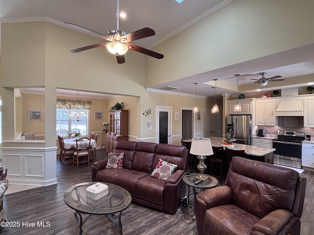 201 Shreveport Ct, Havelock, NC 28532 - living room with ceiling fan, wood finished floors, high vaulted ceiling, ornamental molding, and a chandelier