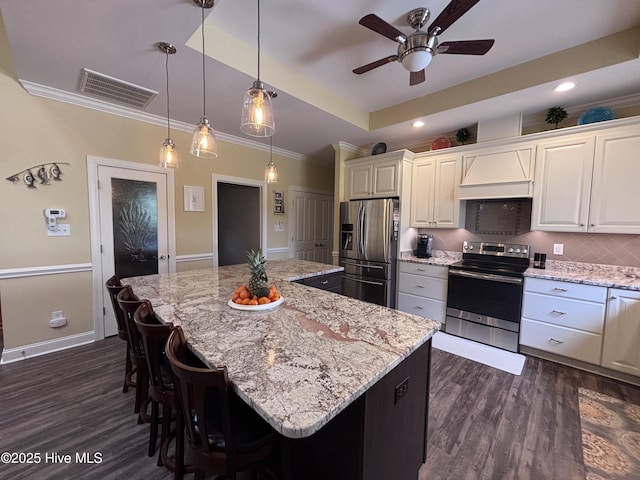 201 Shreveport Ct, Havelock, NC 28532 - kitchen featuring stainless steel appliances, dark wood finished floors, ceiling fan, backsplash, and light stone countertops