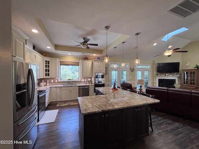 201 Shreveport Ct, Havelock, NC 28532 - kitchen with stainless steel appliances, ceiling fan, dark wood-type flooring, a center island, and open floor plan