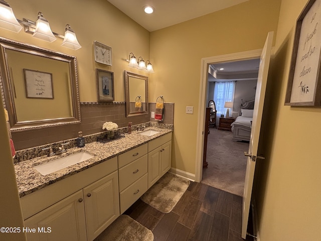 201 Shreveport Ct, Havelock, NC 28532 - ensuite bathroom featuring wood finished floors, double vanity, recessed lighting, baseboards, and decorative backsplash