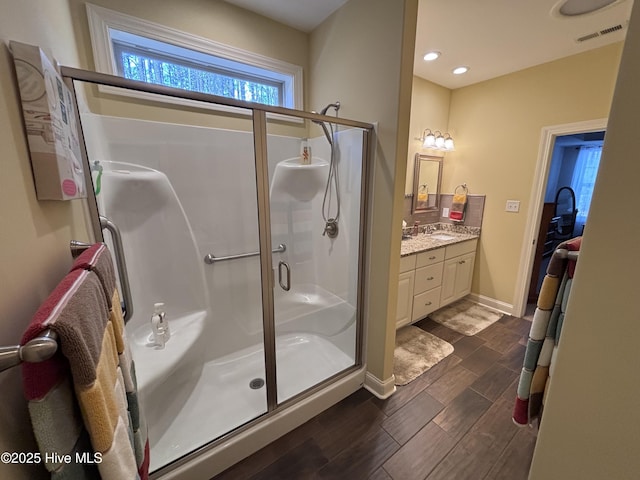 201 Shreveport Ct, Havelock, NC 28532 - full bath with a shower stall, wood finished floors, vanity, baseboards, and recessed lighting