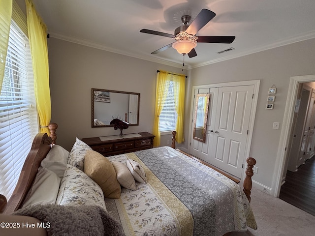 201 Shreveport Ct, Havelock, NC 28532 - carpeted bedroom with crown molding, baseboards, ceiling fan, and a closet