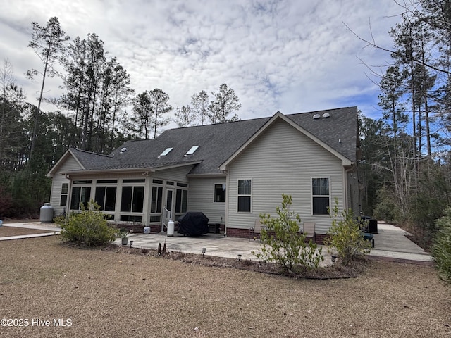 201 Shreveport Ct, Havelock, NC 28532 - rear view of house with a patio, a sunroom, and a shingled roof