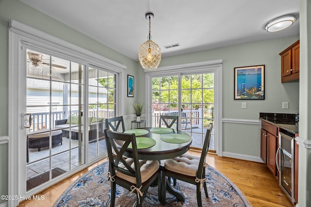 903 Buckingham Rd, Trent Woods, NC 28562 - dining space featuring beverage cooler, light wood-type flooring, baseboards, and ceiling fan