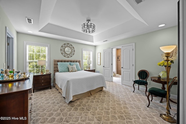 903 Buckingham Rd, Trent Woods, NC 28562 - bedroom featuring a tray ceiling, multiple windows, and baseboards