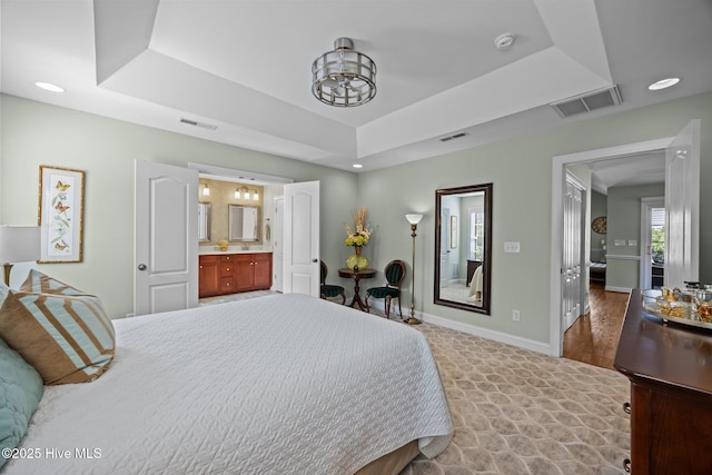903 Buckingham Rd, Trent Woods, NC 28562 - bedroom with a raised ceiling, a chandelier, baseboards, ensuite bathroom, and recessed lighting