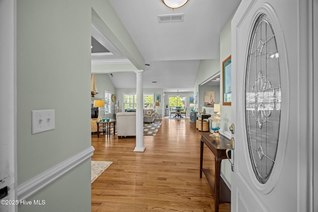 903 Buckingham Rd, Trent Woods, NC 28562 - entryway with ornate columns, light wood finished floors, and a fireplace