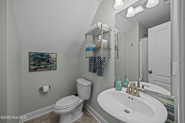 903 Buckingham Rd, Trent Woods, NC 28562 - bathroom featuring a sink, baseboards, toilet, vaulted ceiling, and a shower with shower curtain