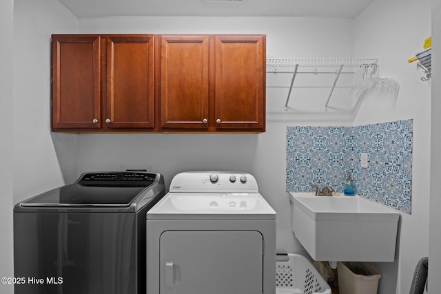 903 Buckingham Rd, Trent Woods, NC 28562 - laundry area featuring cabinet space and independent washer and dryer
