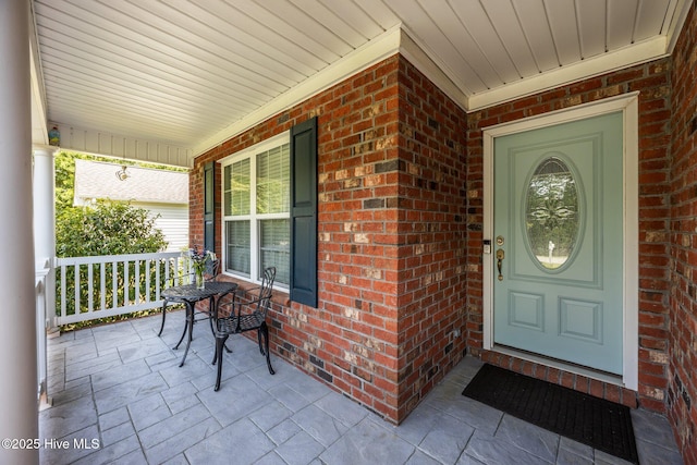 903 Buckingham Rd, Trent Woods, NC 28562 - view of exterior entry with covered porch and brick siding
