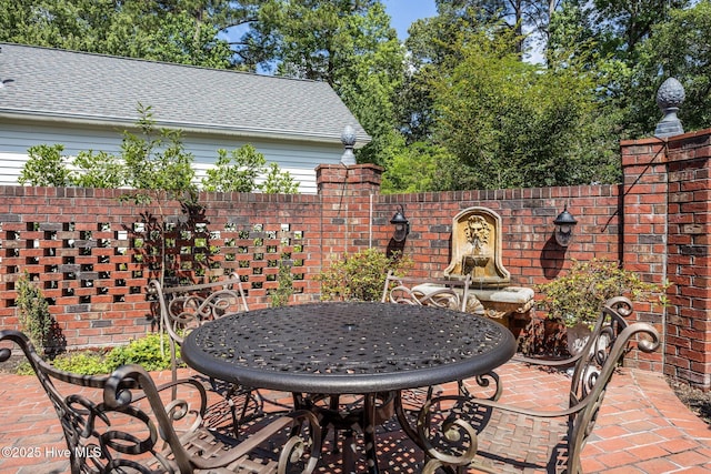 903 Buckingham Rd, Trent Woods, NC 28562 - view of patio / terrace with outdoor dining space and fence