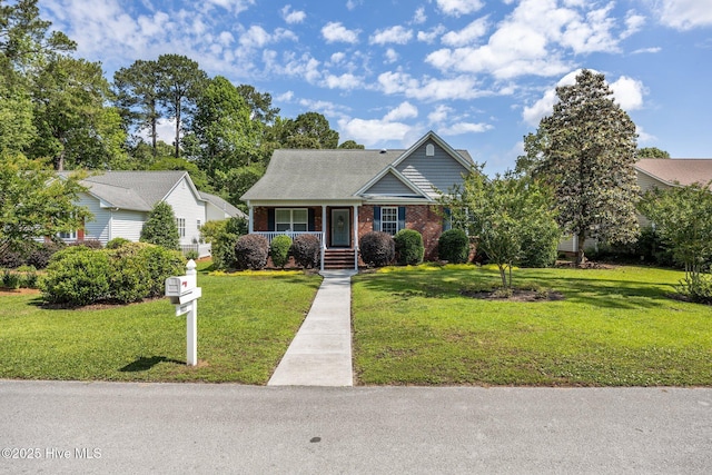 903 Buckingham Rd, Trent Woods, NC 28562 - view of front of house featuring brick siding, a front lawn, and a porch