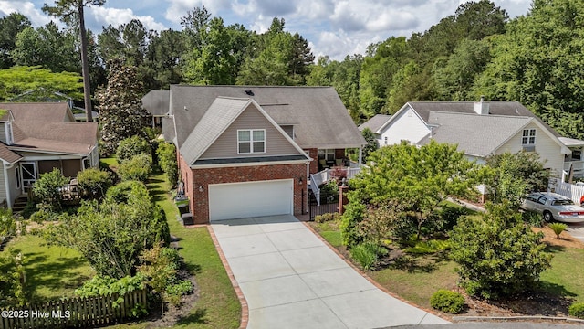 903 Buckingham Rd, Trent Woods, NC 28562 - view of front of house featuring brick siding, an attached garage, and concrete driveway