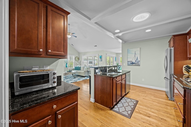 903 Buckingham Rd, Trent Woods, NC 28562 - kitchen featuring stainless steel appliances, light wood finished floors, ceiling fan, a sink, and open floor plan