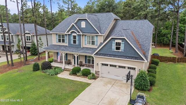 view of front of house featuring a porch, concrete driveway, an attached garage, and a shingled roof