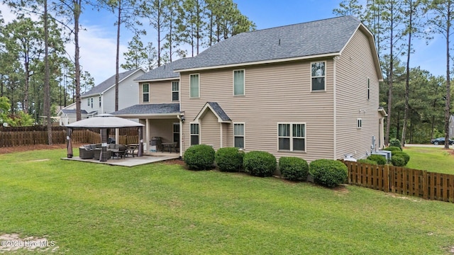 back of property featuring outdoor lounge area, a patio area, a shingled roof, and a gazebo