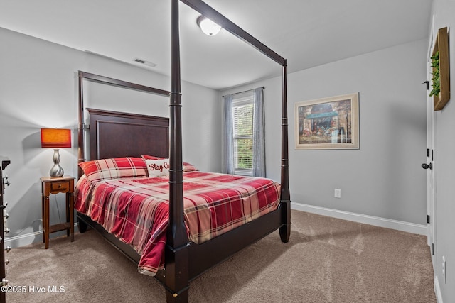 bedroom featuring baseboards and carpet