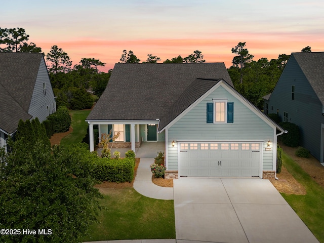 3524 Laughing Gull Ter, Wilmington, NC 28412 - view of front of home featuring concrete driveway, a yard, and a shingled roof