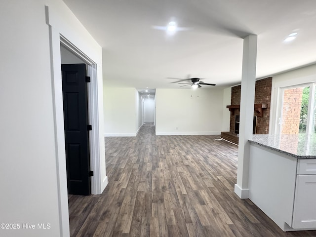 200 Colonial Ave, Clinton, NC 28328 - unfurnished living room with dark wood-style flooring, ceiling fan, a fireplace, and recessed lighting