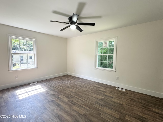 200 Colonial Ave, Clinton, NC 28328 - empty room featuring plenty of natural light, dark wood-style floors, and ceiling fan