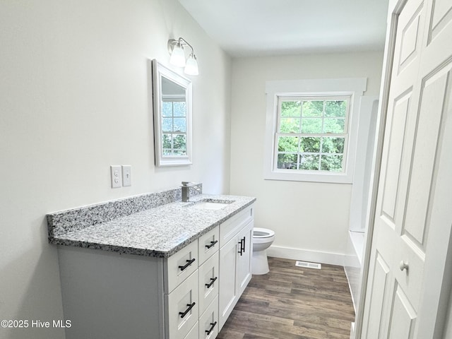 200 Colonial Ave, Clinton, NC 28328 - full bathroom with vanity, plenty of natural light, and wood finished floors