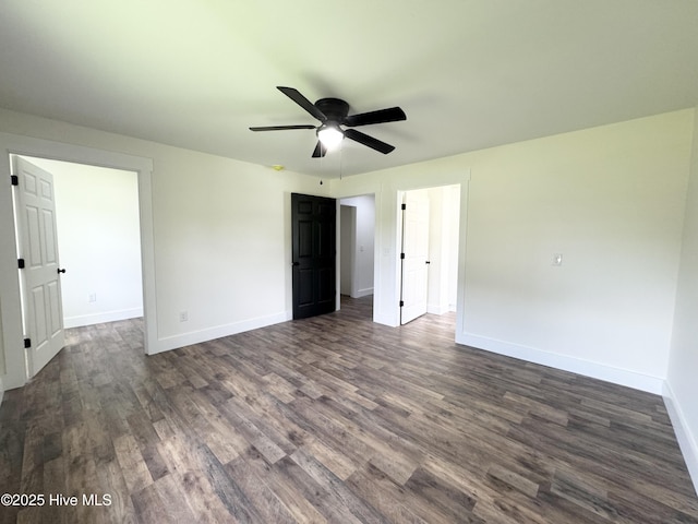 200 Colonial Ave, Clinton, NC 28328 - unfurnished bedroom with dark wood-style floors and a ceiling fan