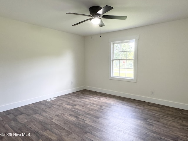 200 Colonial Ave, Clinton, NC 28328 - spare room with a ceiling fan and dark wood-type flooring
