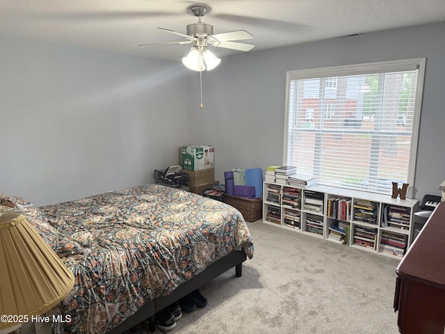 bedroom featuring carpet floors and a ceiling fan