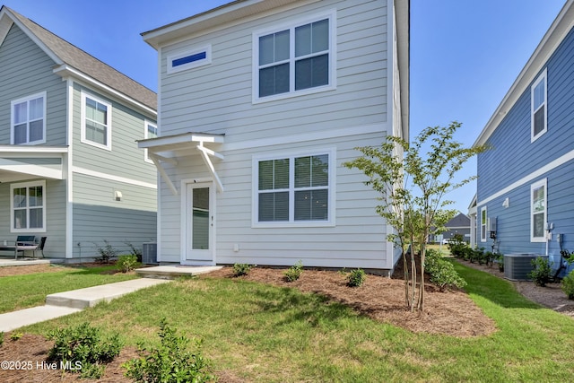 1009 Gathering Way, Wilmington, NC 28412 - view of front facade with central AC unit and a front lawn