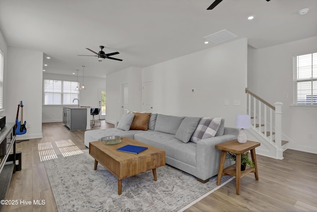 1009 Gathering Way, Wilmington, NC 28412 - living area with ceiling fan, light wood-style floors, stairs, and recessed lighting