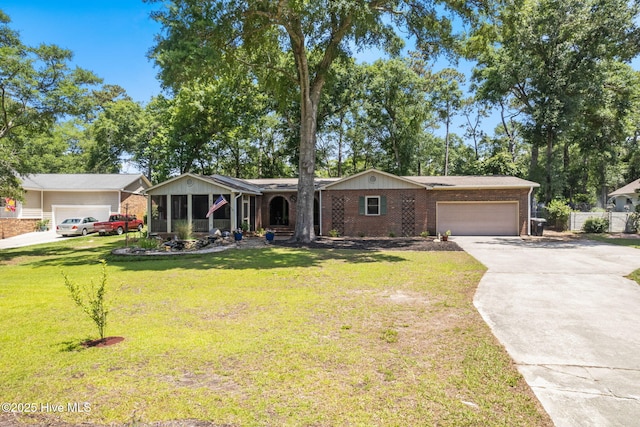 212 Park Ave, Southport, NC 28461 - ranch-style home featuring an attached garage, brick siding, and driveway