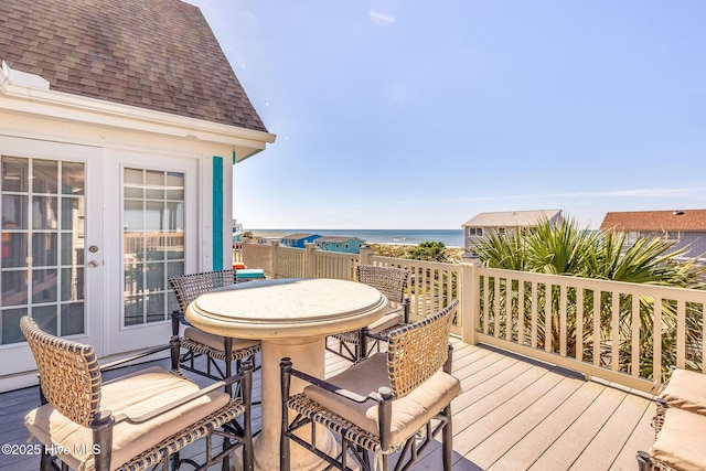 308 E Beach Dr, Oak Island, NC 28465 - deck featuring outdoor dining space and french doors