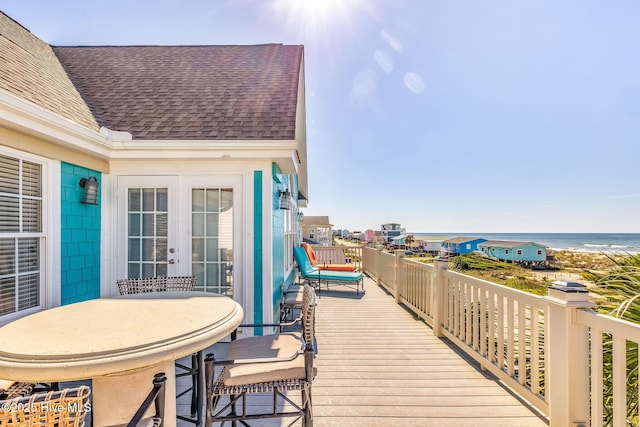 308 E Beach Dr, Oak Island, NC 28465 - wooden terrace with french doors and a water view
