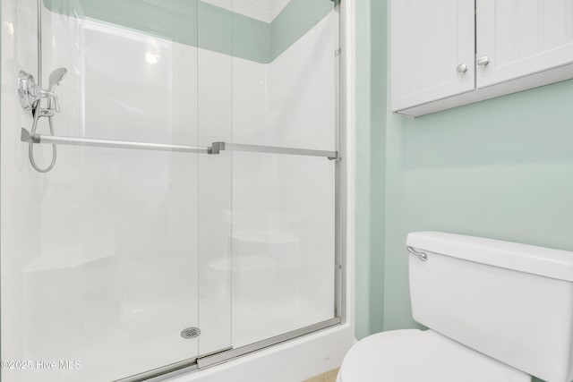 308 E Beach Dr, Oak Island, NC 28465 - bathroom with toilet and a shower stall
