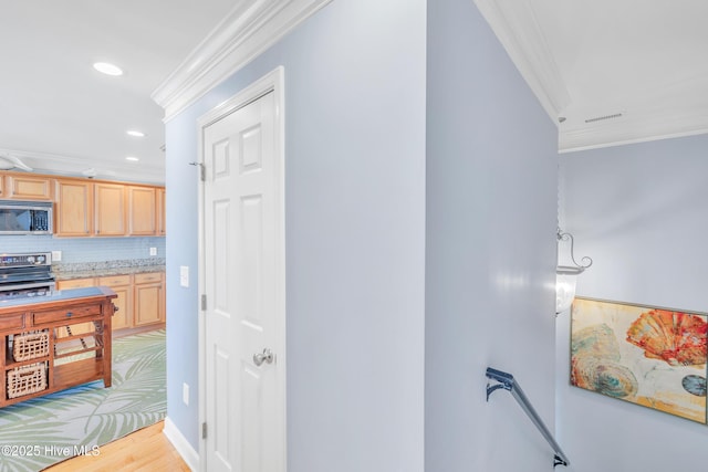 308 E Beach Dr, Oak Island, NC 28465 - hall with crown molding, an upstairs landing, light wood finished floors, and recessed lighting
