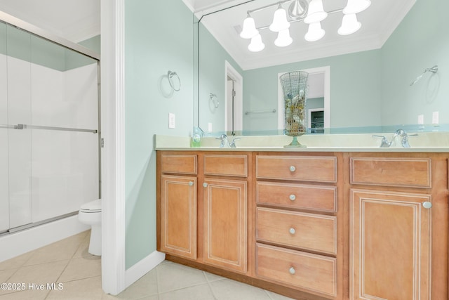 308 E Beach Dr, Oak Island, NC 28465 - bathroom featuring tile patterned floors, double vanity, a stall shower, a chandelier, and crown molding
