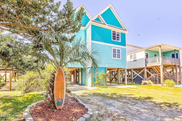 308 E Beach Dr, Oak Island, NC 28465 - back of property with a carport