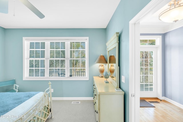 308 E Beach Dr, Oak Island, NC 28465 - bedroom with baseboards, ceiling fan, and wood finished floors