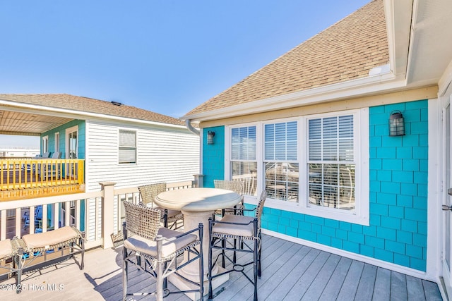 308 E Beach Dr, Oak Island, NC 28465 - wooden deck featuring outdoor dining area