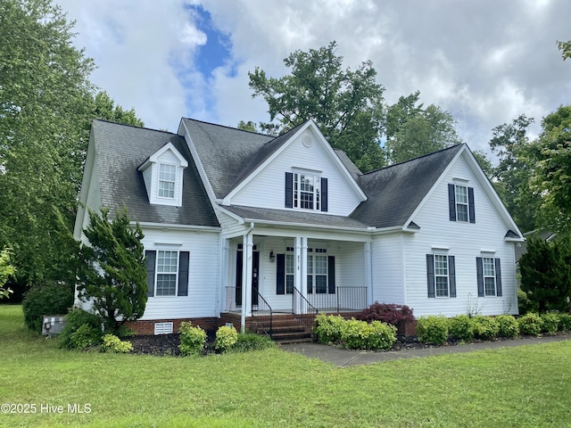 view of front of home featuring covered porch, a front lawn, and a shingled roof