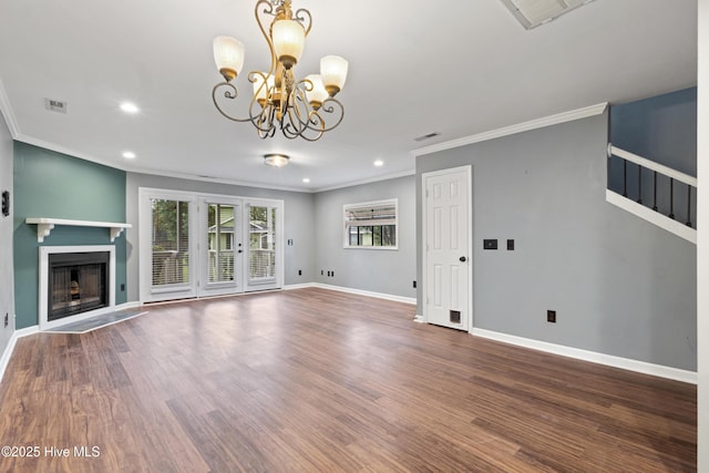 unfurnished living room with ornamental molding, recessed lighting, a chandelier, baseboards, and a fireplace