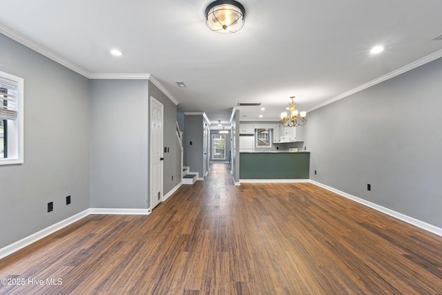 unfurnished living room with a chandelier, crown molding, dark wood-type flooring, recessed lighting, and baseboards