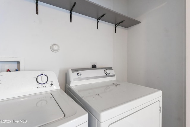 laundry area with separate washer and dryer