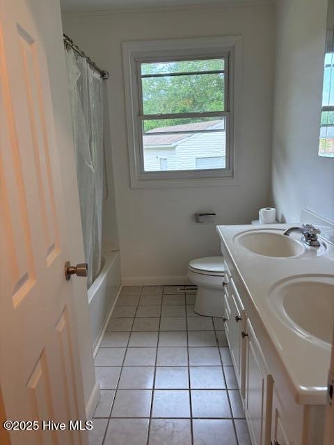 6007 Meadow Ln, Goldsboro, NC 27530 - full bath with plenty of natural light, baseboards, tile patterned flooring, and double vanity