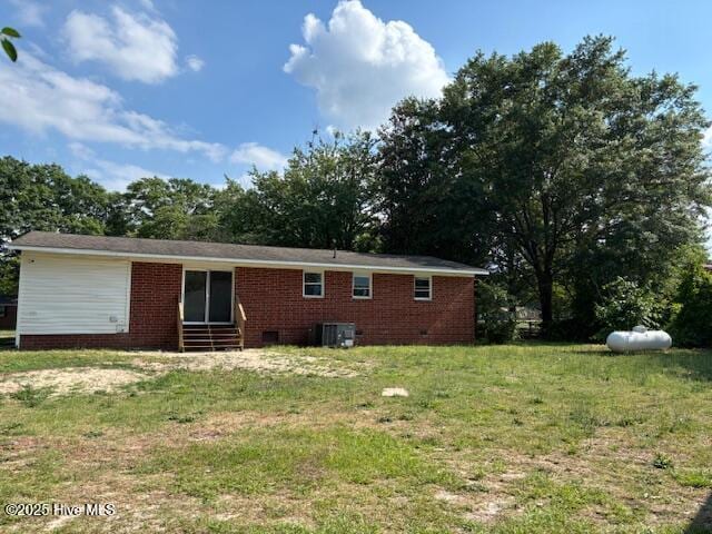 6007 Meadow Ln, Goldsboro, NC 27530 - rear view of property featuring a lawn, entry steps, cooling unit, and brick siding