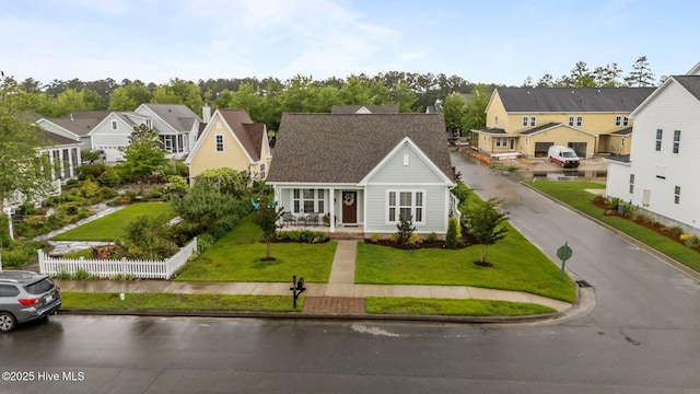 traditional-style house featuring a residential view and covered porch