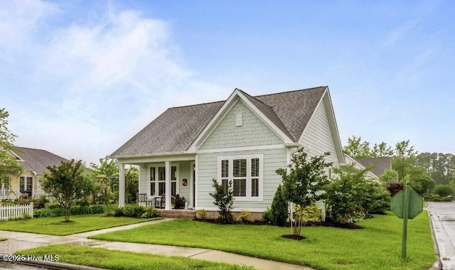 4083 Reunion Pointe Ln, New Bern, NC 28562 - view of front of property with a front lawn, a porch, and a shingled roof