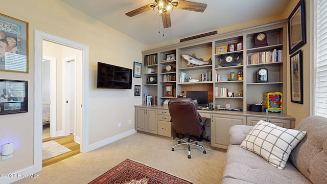 4083 Reunion Pointe Ln, New Bern, NC 28562 - home office with light colored carpet, ceiling fan, and baseboards