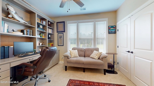 4083 Reunion Pointe Ln, New Bern, NC 28562 - office area featuring a ceiling fan, light colored carpet, built in study area, and baseboards