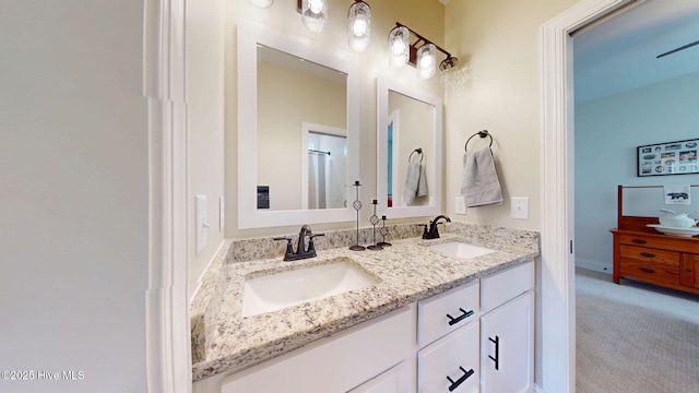 bathroom featuring double vanity